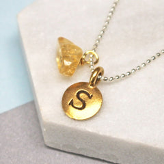 Close up of Personalised Initial Birthstone Necklace gold