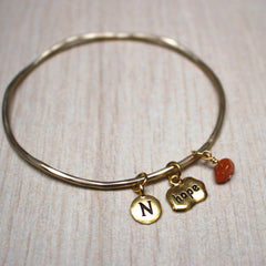 Gold birthstone hope mantra bangle close up