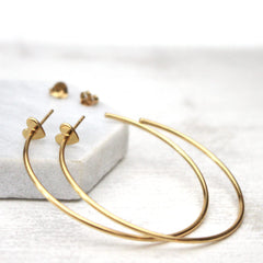 Close up of Heart Hoop Earrings Gold