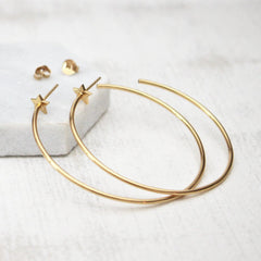 Close up of Star Hoop Earrings gold