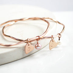 Rose gold personalised bangle with pearls and heart charms