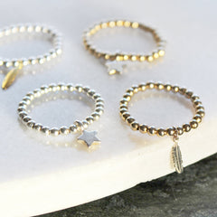 Close up of stretch ring selection star ring and feather ring