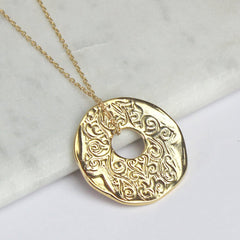 Close up of lucky hamsa hand necklace in gold with no personalisation