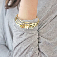 Heart and crystal bangle set worn by model