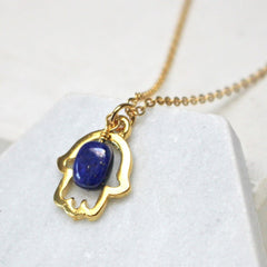 Close up of Lucky Hamsa Birthstone Charm Necklace custom pendant gold