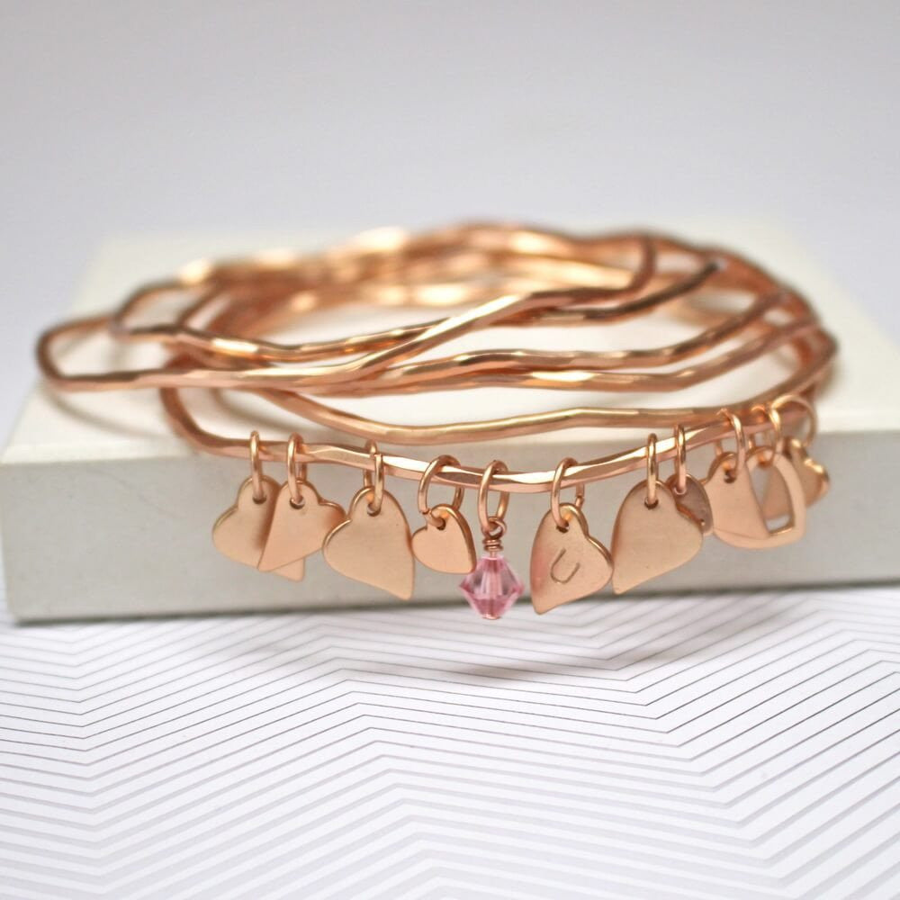 Gold gold bracelet set with personalised heart charms