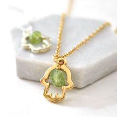 Close up of Lucky Hamsa Birthstone Charm Necklace custom pendant gold