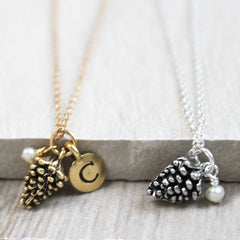 Close up of Pine Cone Necklace, silver and gold