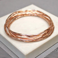 On trend rose gold stacking bangle set