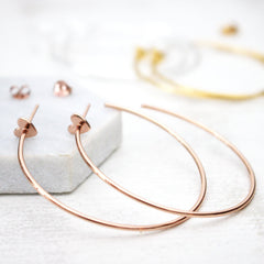 Close up of Heart Hoop Earrings rose gold