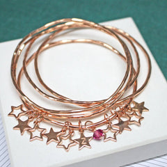 Personalised rose gold bangle set with star charms and swarovski crystals