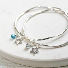 Silver personalised bangle with star charm and crystals.