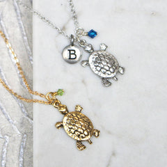 Close up of Turtle Charm Necklace silver and gold