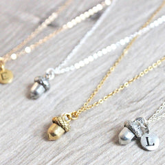 Close up of Acorn Necklace, silver with letter charm and gold
