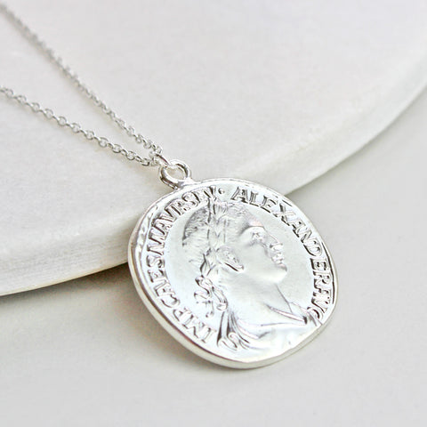 Add some mystique to your look with this magical coin necklace. This wil...