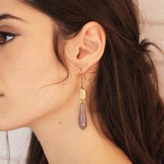 model wearing light purple geometric gold drop earrings