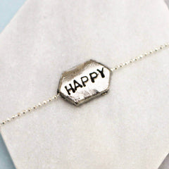Happy hand stamped word bracelet
