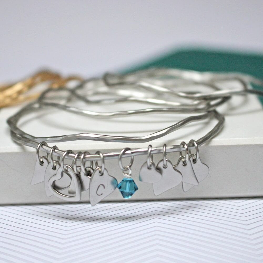 Antique silver bangles set with heart charms and crystals