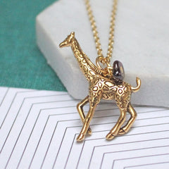 Close up of Giraffe Charm Necklace gold