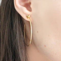 Close up of Heart Hoop Earrings gold