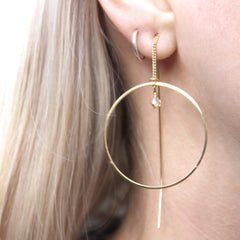 Close up of Thread Through Hoop Earrings gold