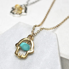 Close up of Lucky Hamsa Birthstone Charm Necklace gold