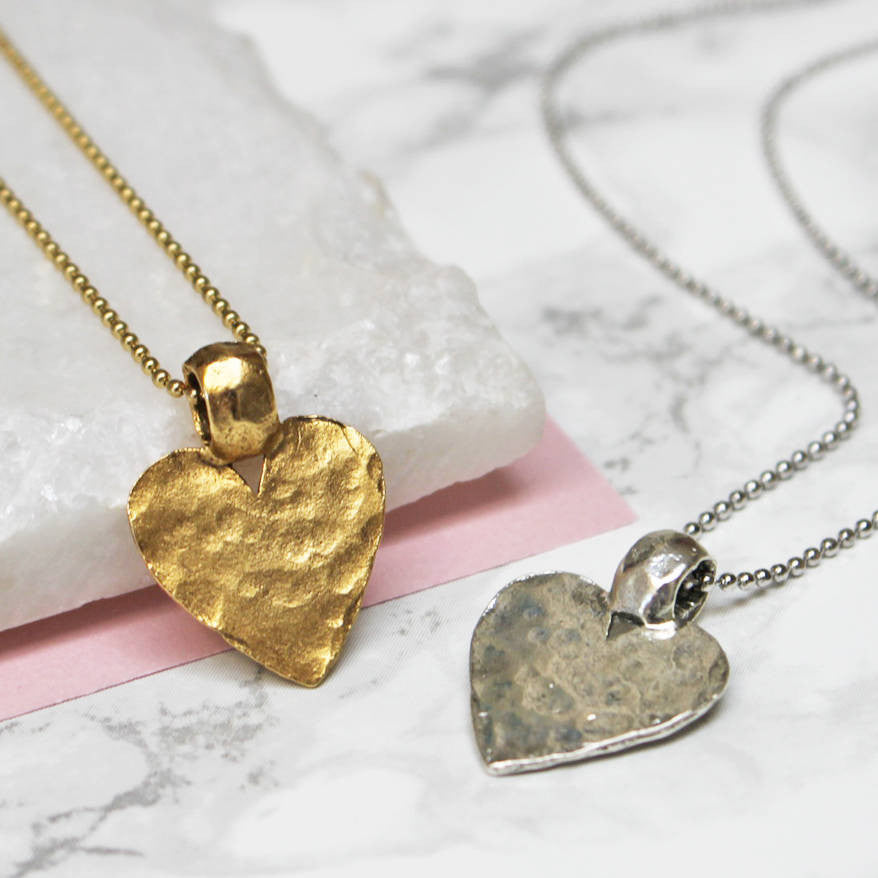 Close up of Hammered Gold And Silver Heart Pendant