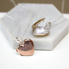 Close up of rose gold and gold Personalised Message Heart Locket Necklace
