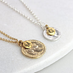 Personalised coin necklace, gold and silver with initial charms