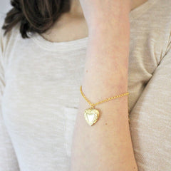 Vintage heart locket bracelet in gold worn by model