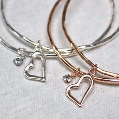 Close up of heart and diamante charm detail on love heart stacking bangle
