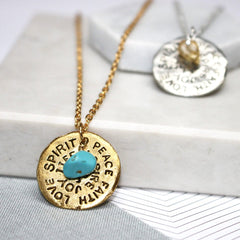 Close up of Birthstone Mantra Necklace gold