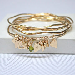 Gold bangle set with green Swarovski crystal and personalised heart charm