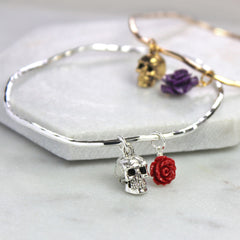 Silver and gold skull bangle with red and purple rose