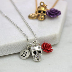 Silver and gold skull necklace with initials and roses