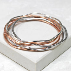 Silver and rose gold stacking bangles