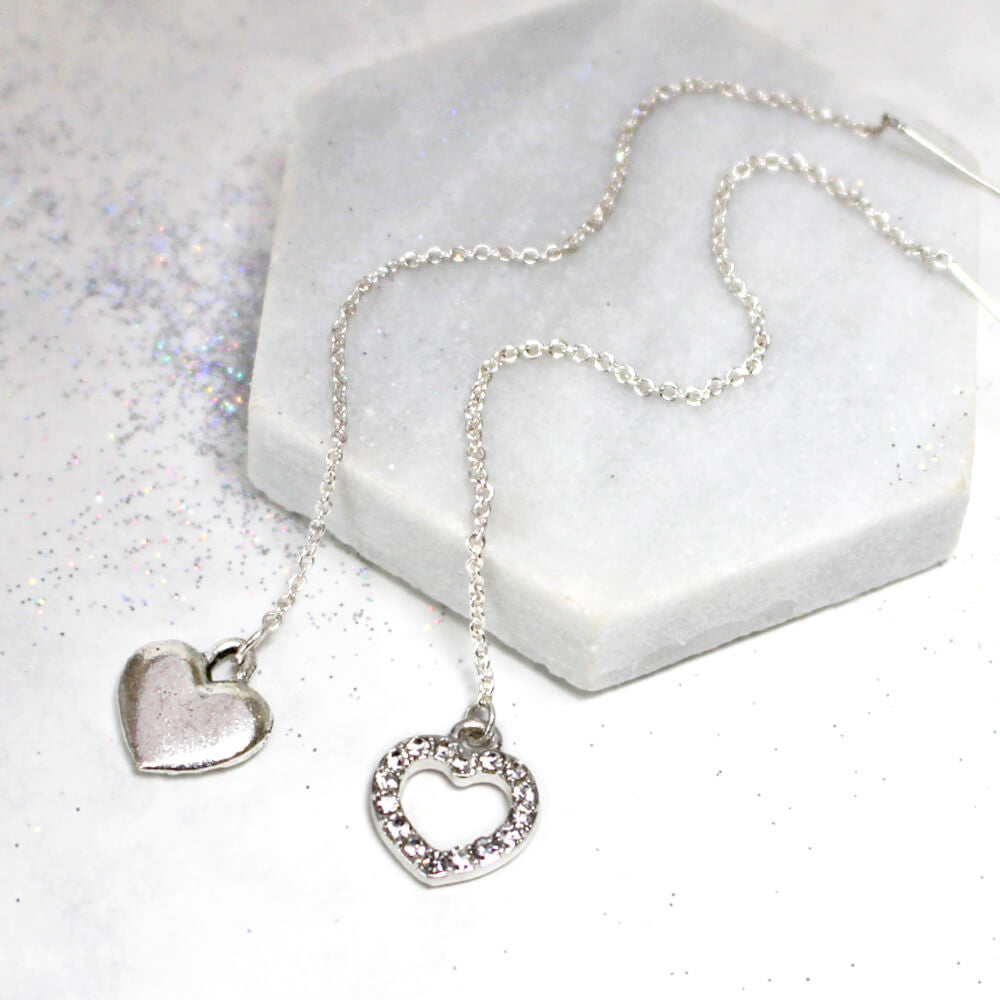 Close up of Diamante Heart Thread Through Earrings silver