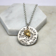Close up of Birthstone Mantra Necklace silver