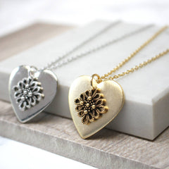 Close up of Vintage Lace Heart Pendant, gold and silver
