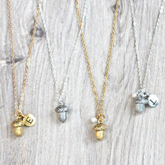Close up of personalised Acorn Necklace, silver and gold
