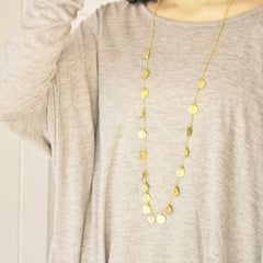 Medium chains of gold necklace on model