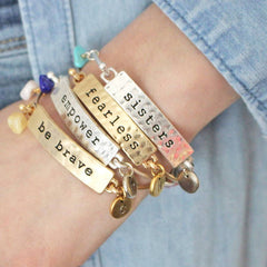 Model shot of sisters, fearless, empower and be brave mantra bangles