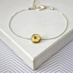 Hand stamped initial hexagon bracelet with R in gold