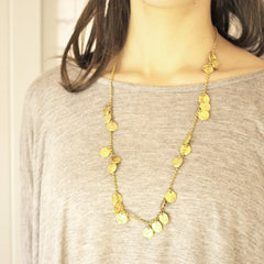 Short chains of gold necklace on model